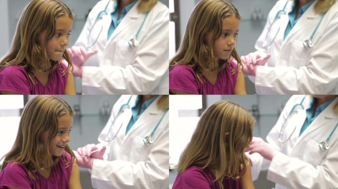 医生给小女孩打针，打疫苗
