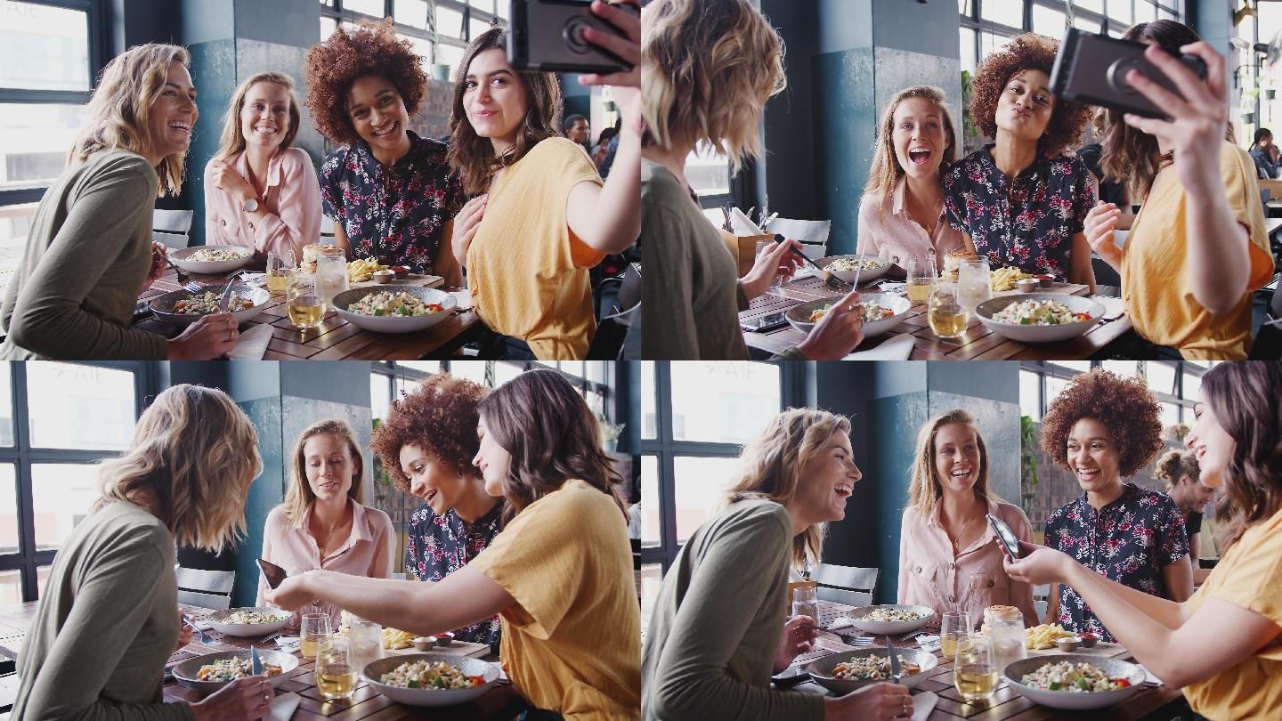 四位女性朋友饭前在餐厅自拍