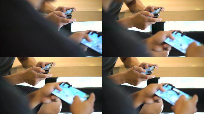 两个男人用手机玩电子游戏的特写镜头