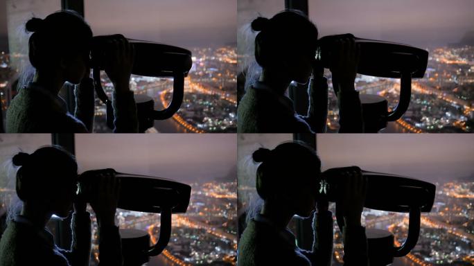 年轻女子透过旅游望远镜探索城市夜景