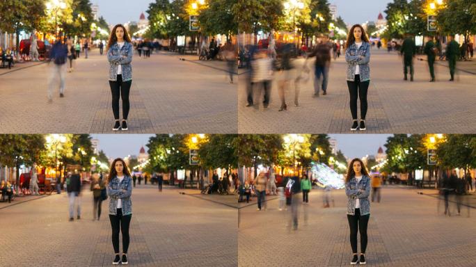 一位美女交叉着双臂站在街上看着镜头