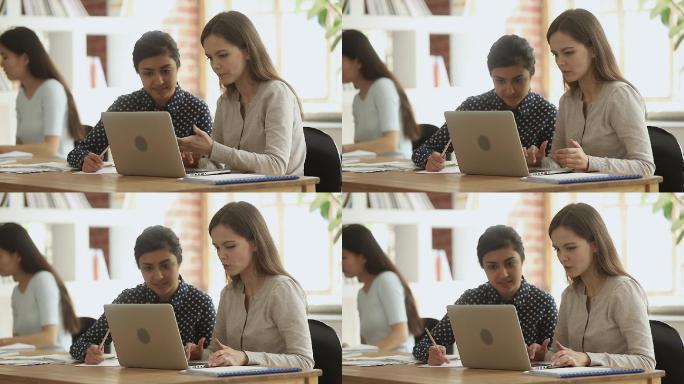 大学课堂上女学生和教师使用电脑