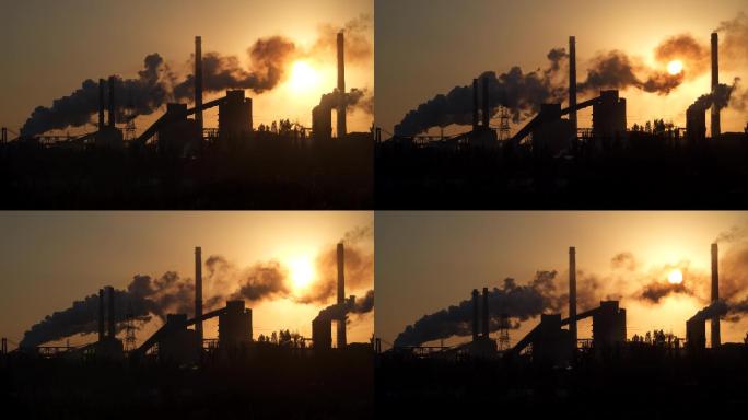 日出时工厂的管道污染空气。