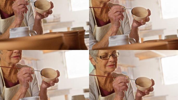 女陶工画碗创意商业陶瓷