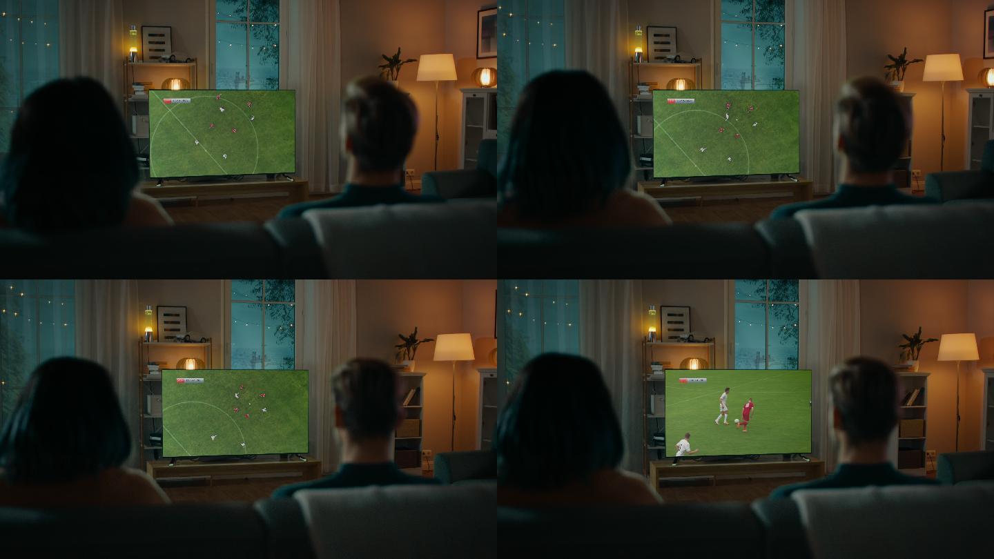 晚上，夫妇坐在沙发上看电视上的足球比赛