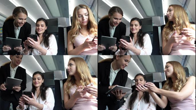 乘务员用电子设备检查乘客的机票