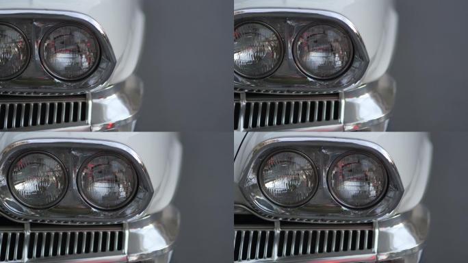 白色老式汽车的特写摇摄大灯