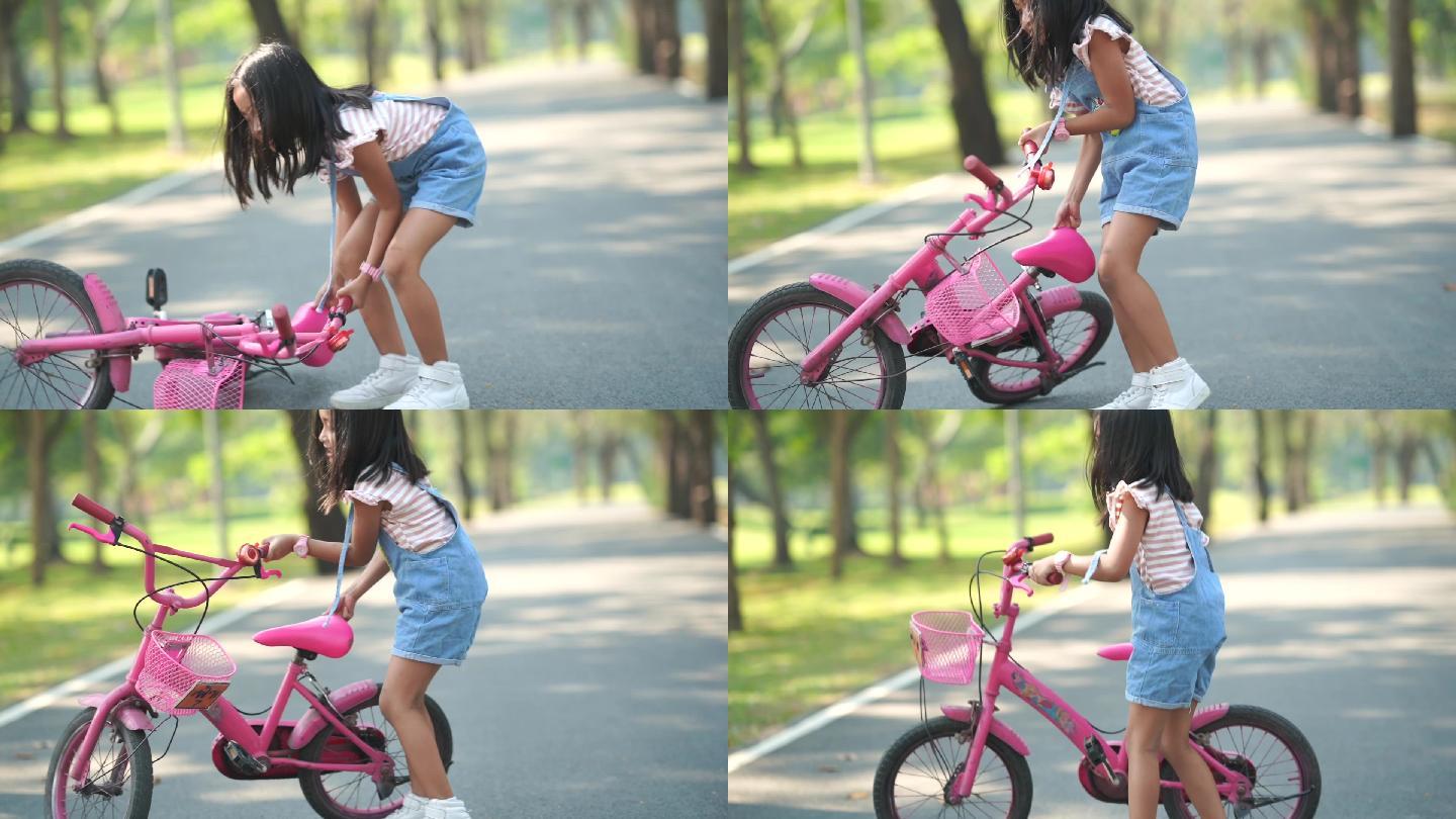 推起自行车的小女孩