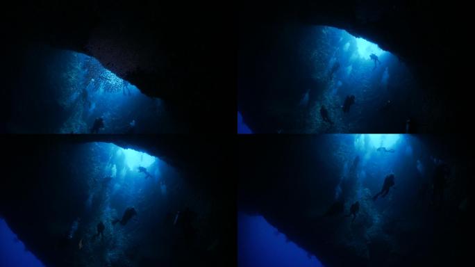 在海底洞穴里潜水游客旅行海洋钟乳石