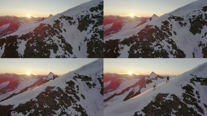 日出时登山者到达山顶的鸟瞰图