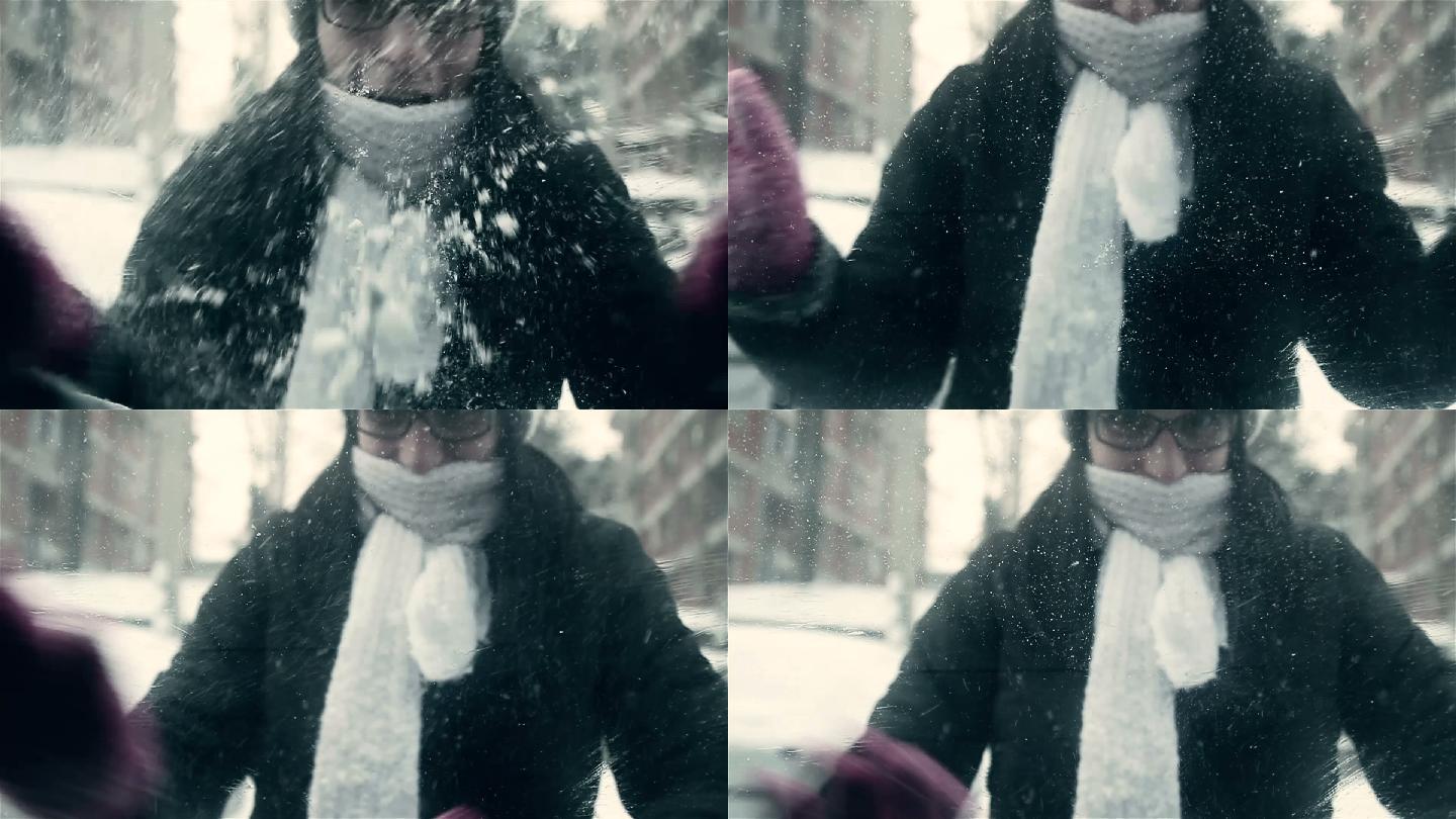 女人带着手套清除车窗上的雪