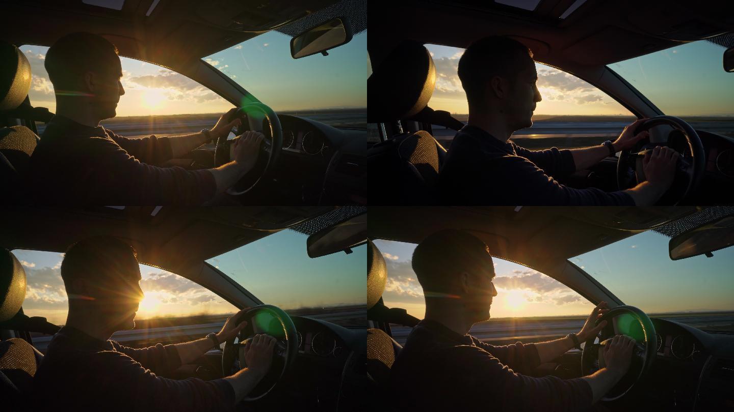 在路上开车高速行驶夕阳落日男人开车听音乐