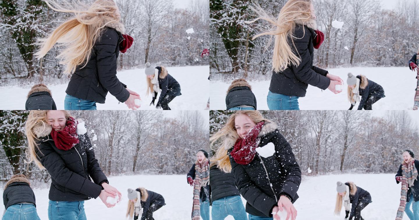一群朋友在雪地里玩雪球