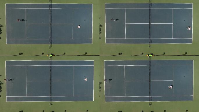 男女在球场上打网球