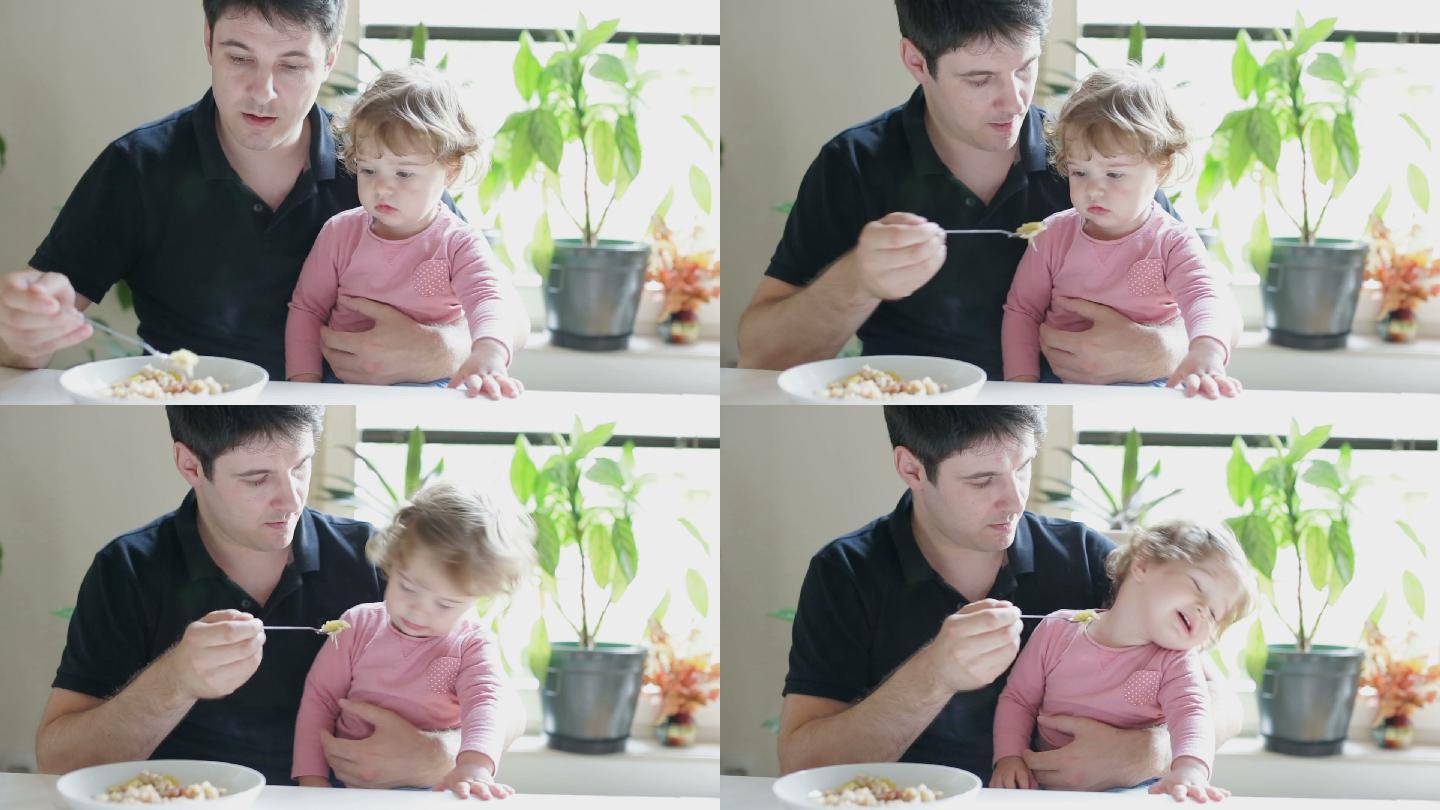 父亲喂小女儿吃饭孩子拒绝吃饭早晨家庭与一