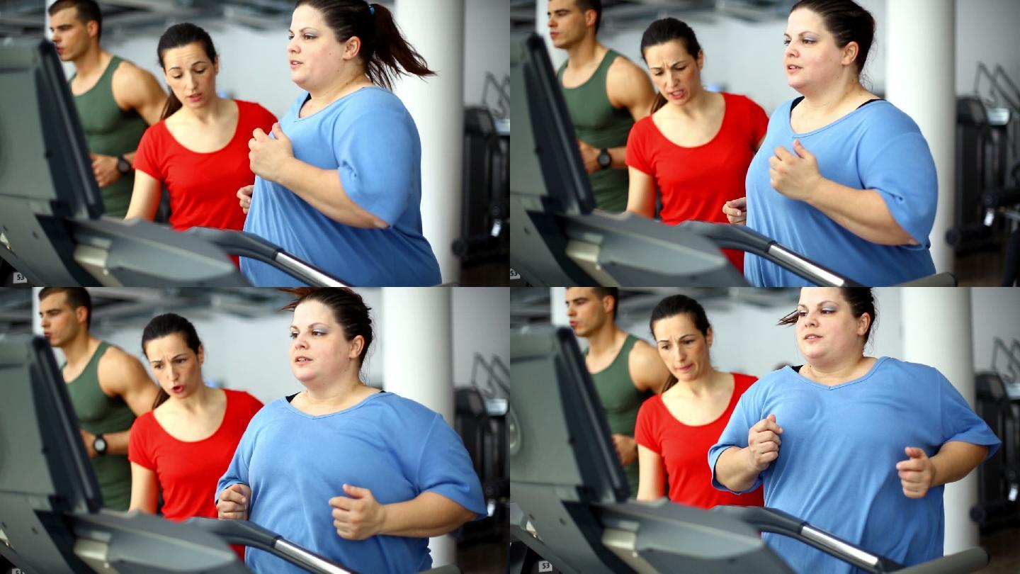 在跑步机上锻炼的超重妇女。