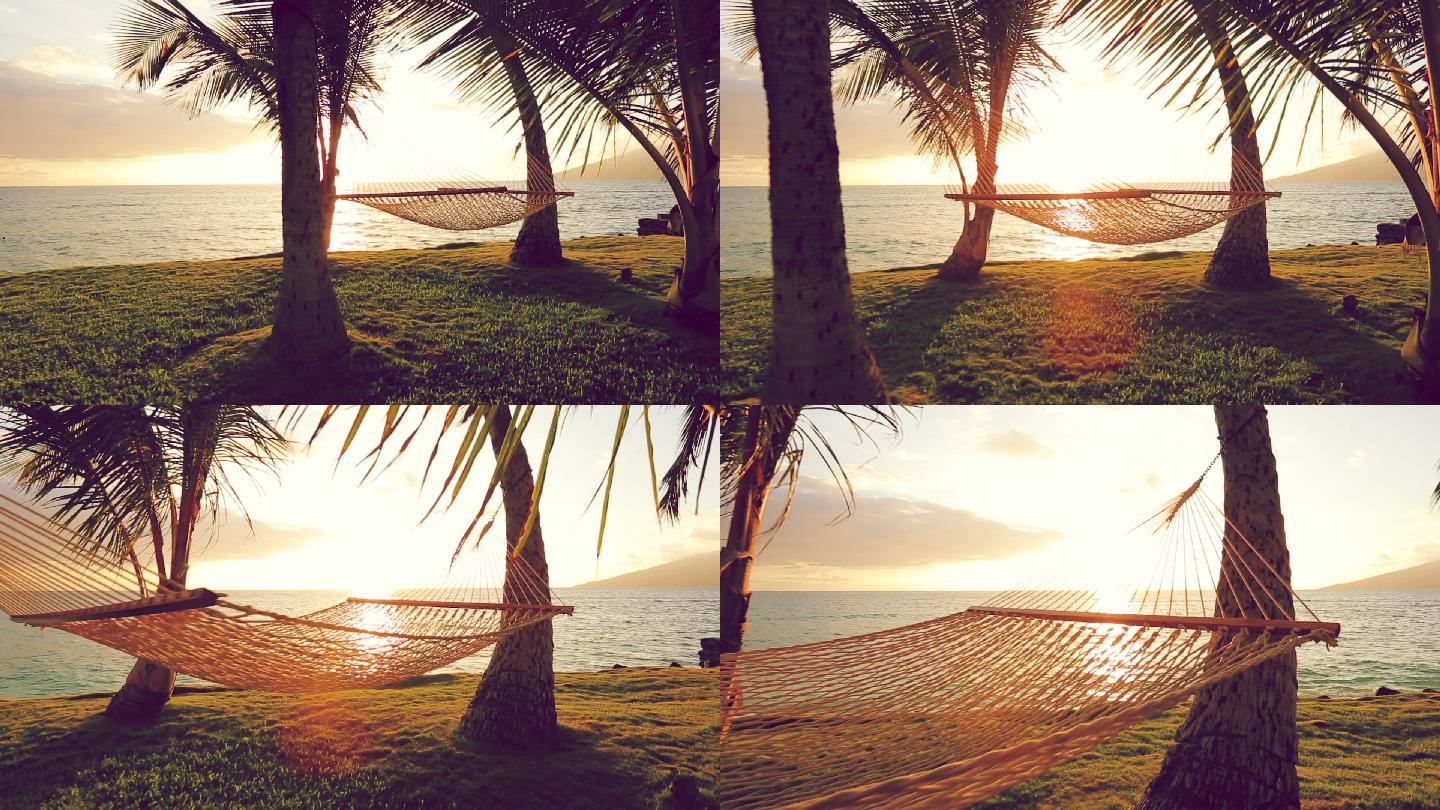 日落时的吊床和棕榈树