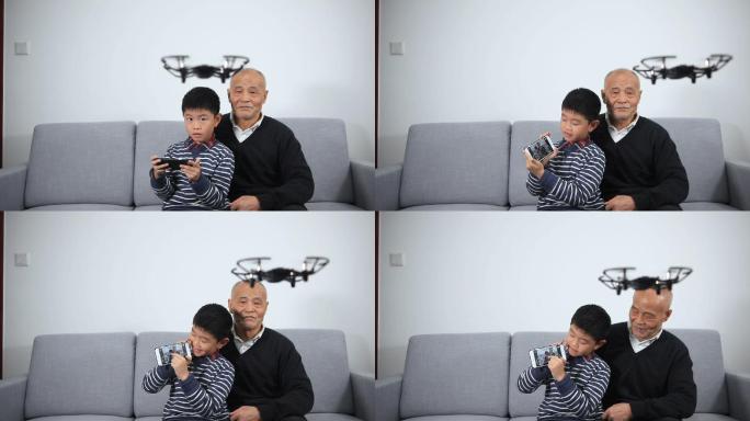 爷爷和孙子在玩无人机