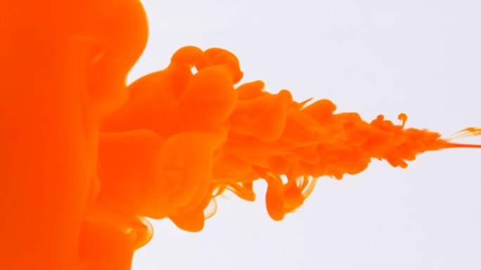 橙色喷墨概念水下喷墨和着色表面抽象背景