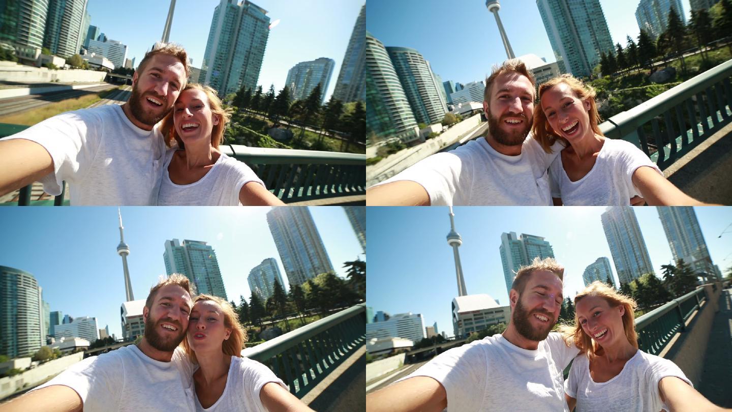 一对年轻夫妇在多伦多拍自拍照