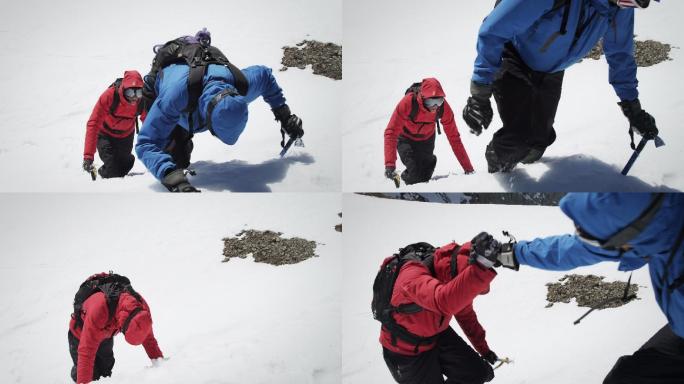 登山者到达白雪覆盖的山峰