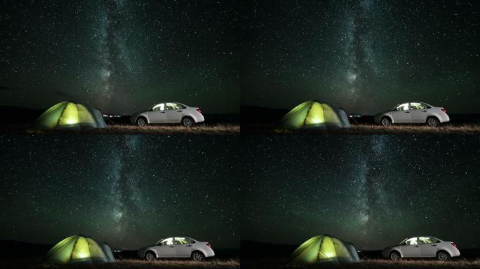 银河在夜晚的露营上空旋转