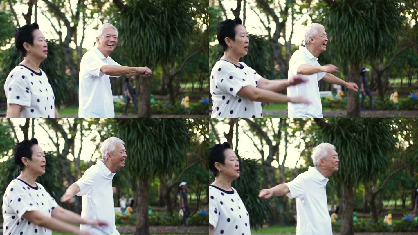 老年夫妇在公园里跳舞做有氧运动