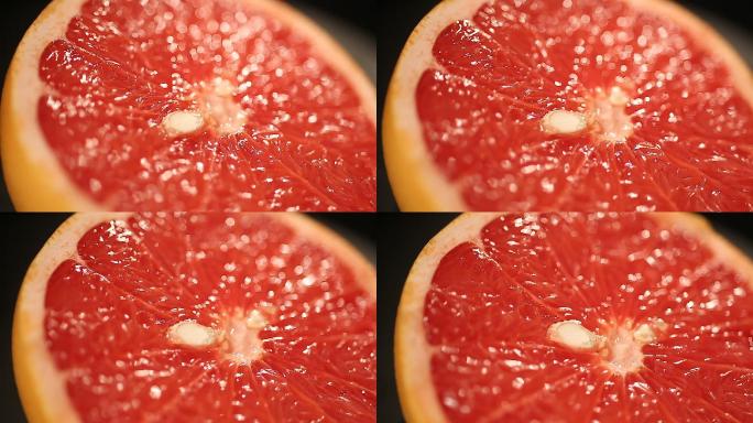 多汁的葡萄柚飞溅水滴飞溅高速摄影健康饮食