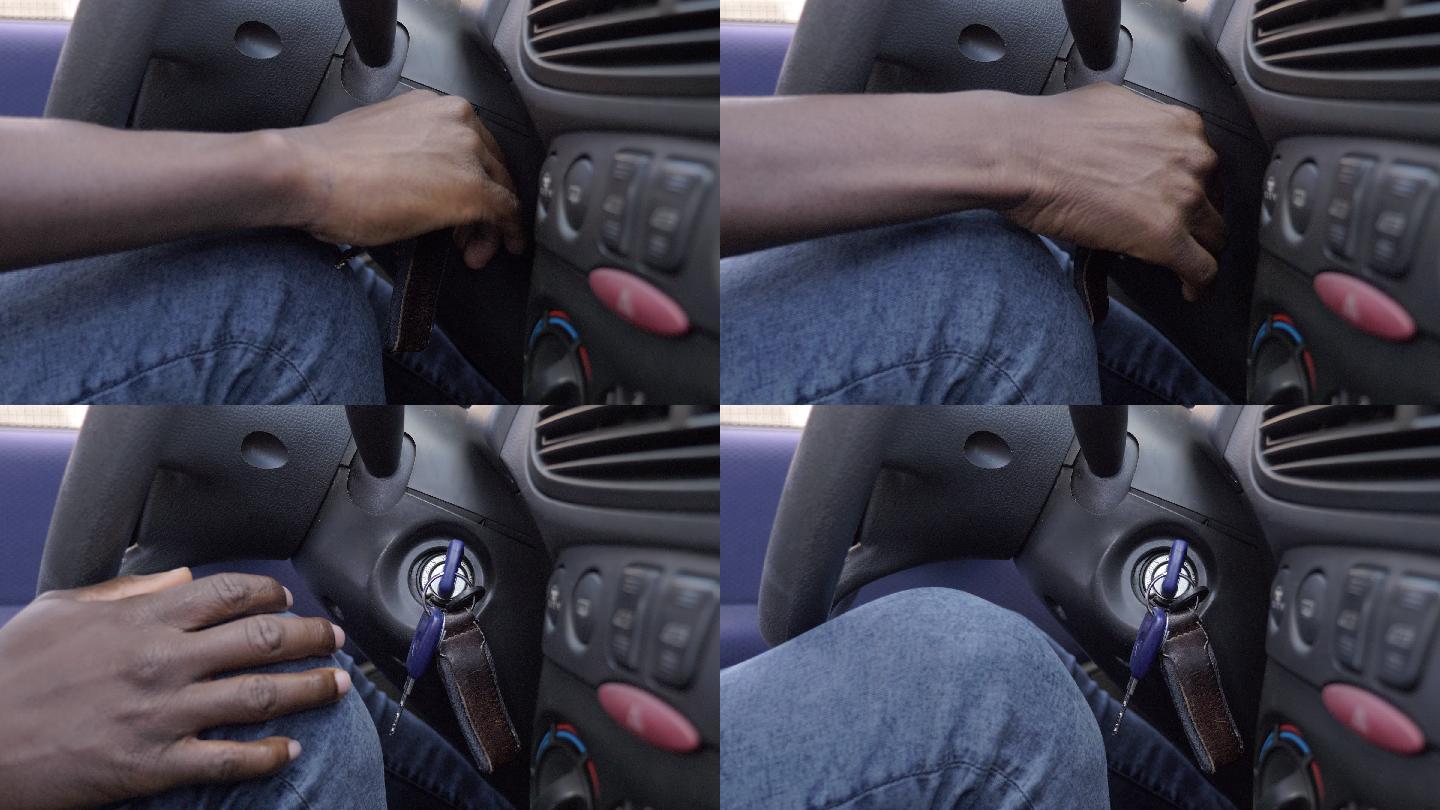 男子用手转动钥匙打开汽车。特写