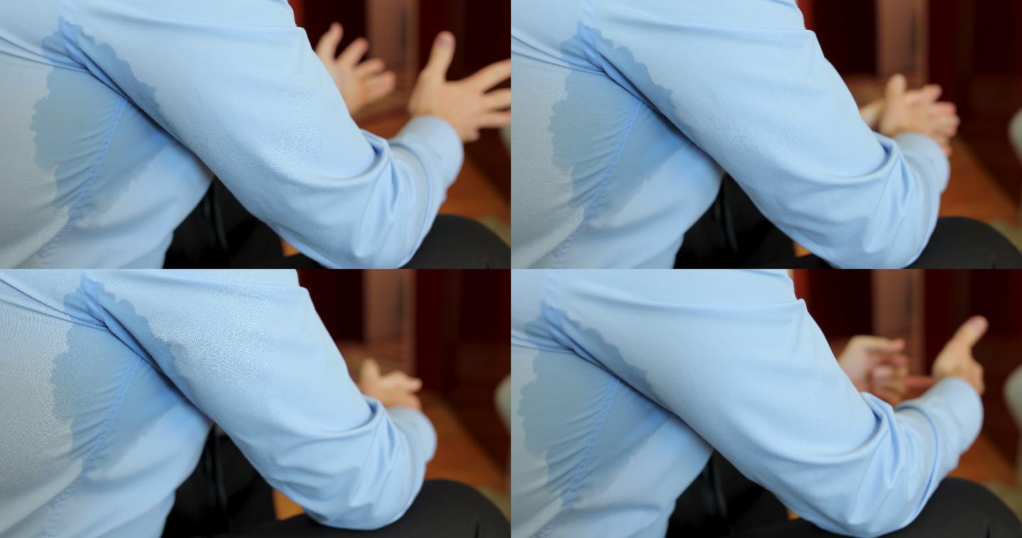 谈话时腋下出汗的男子