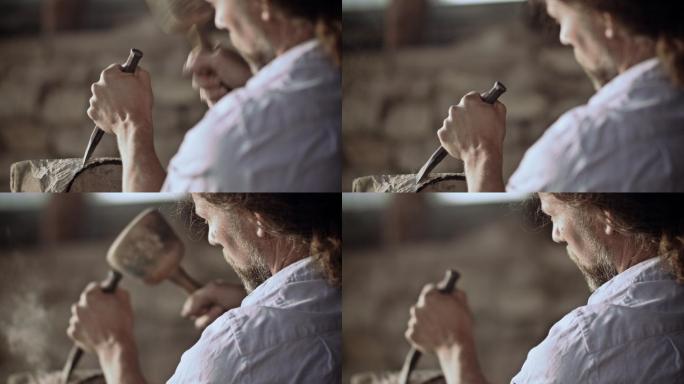 石匠用锤子和凿子雕刻石头