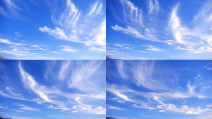 白色蓬松的云在湛蓝的天空中划过