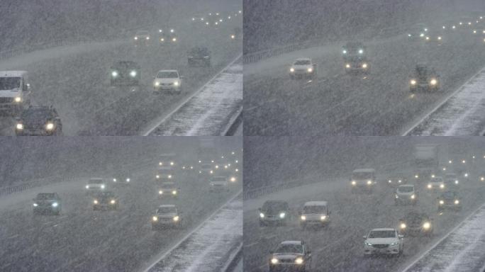 暴风雪中在高速公路上行驶的汽车