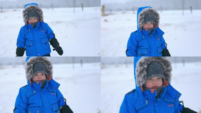 在雪地里行走的小男孩