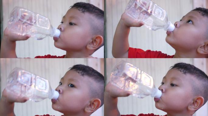 男孩喝瓶装水