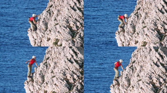 在海边攀岩的女人极限运动攀岩爬山