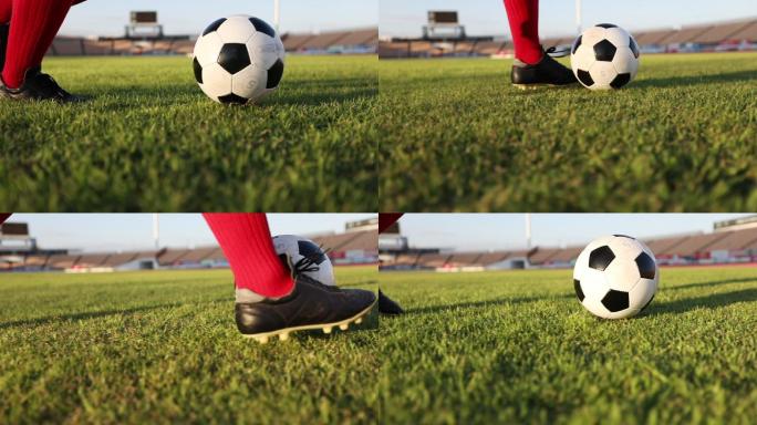 足球运动员以慢动作球场上展示步法和踢射球