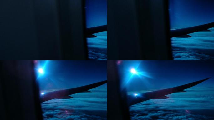飞机在月光照耀的云层上飞行