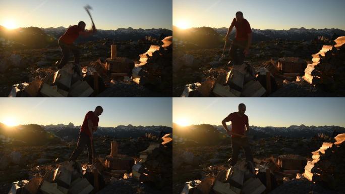 日落时在山上劈柴的男子
