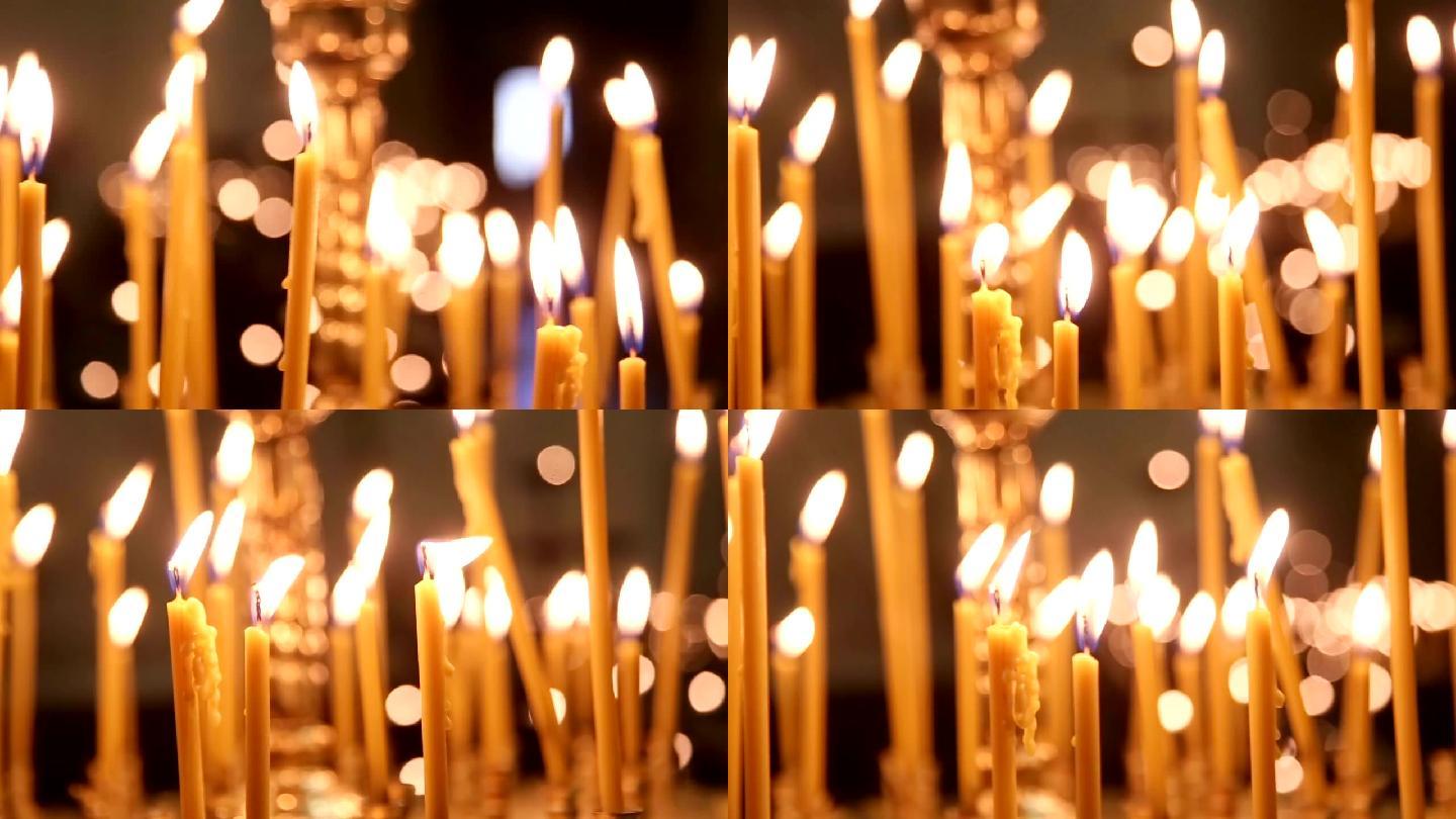 在教堂的祭坛前点燃蜡烛