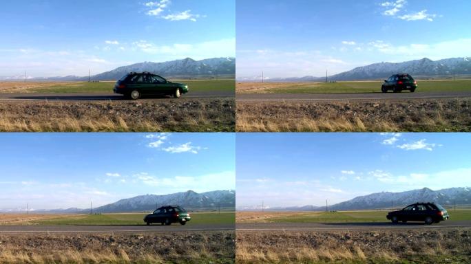 一辆汽车在美丽的山谷里的高速公路上掉头转