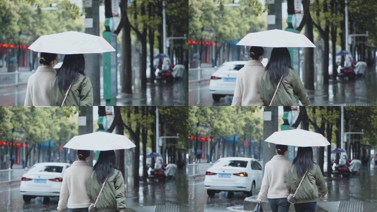 城市人文打着雨伞的背影