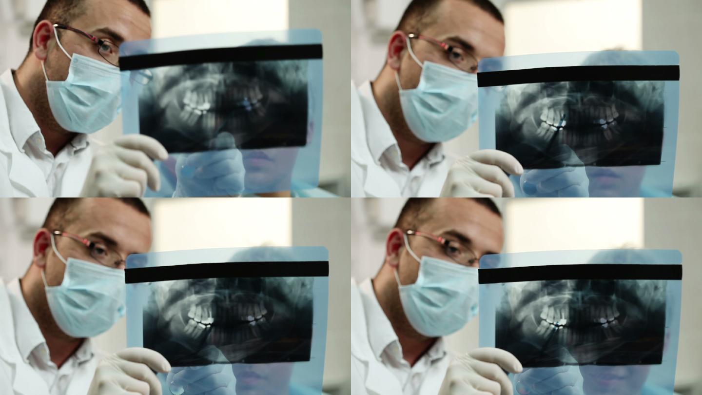 牙科x光片，牙医正在给病人看x光片