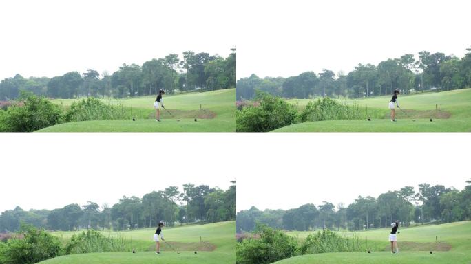 年轻的女子打出了完美的高尔夫球