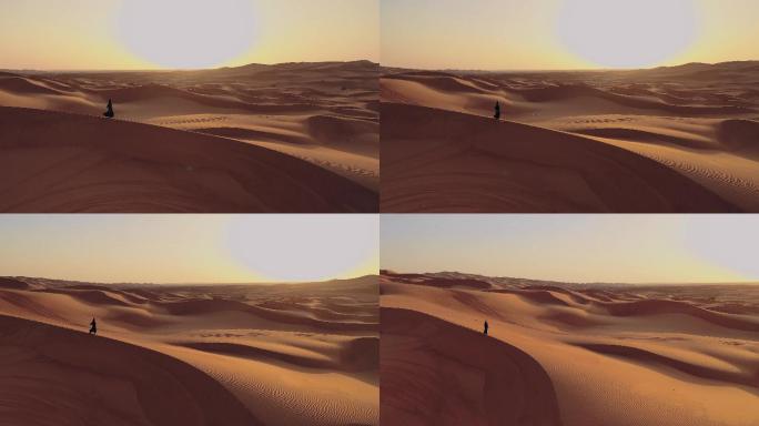 在沙漠中行走的女人