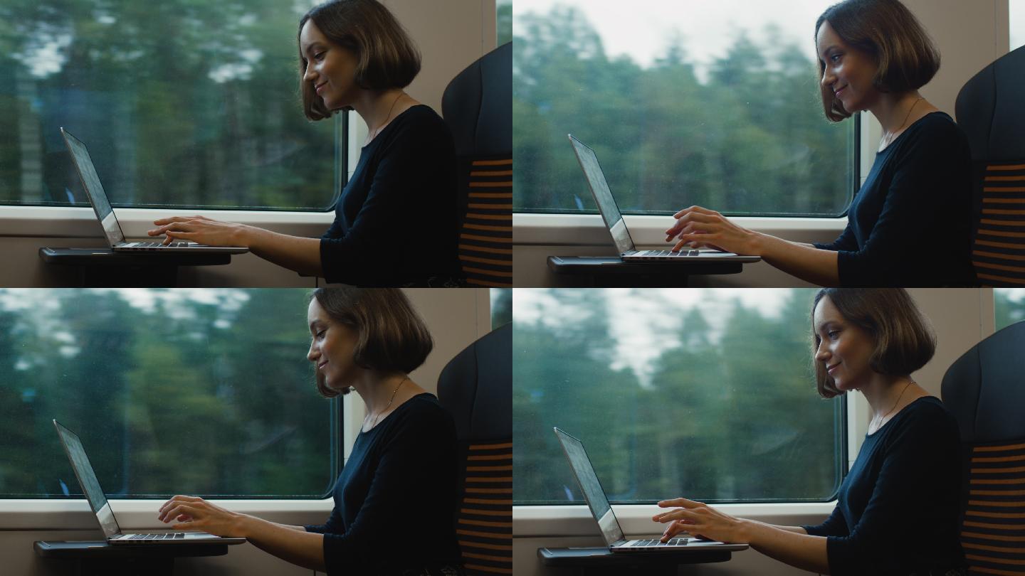 在火车上用笔记本电脑工作的女人。
