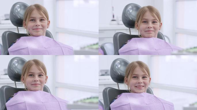 坐在牙科椅上微笑的女孩