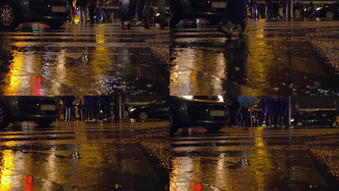 人们在城市里的雨夜里过马路