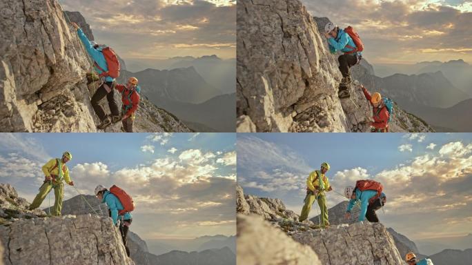 男女登山运动员攀登到山顶