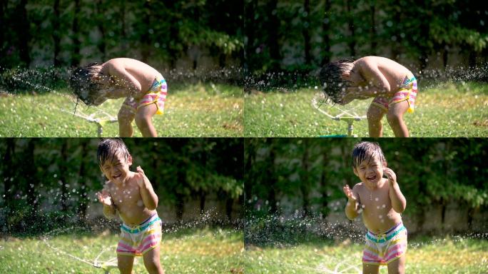 宝宝在草坪里玩水